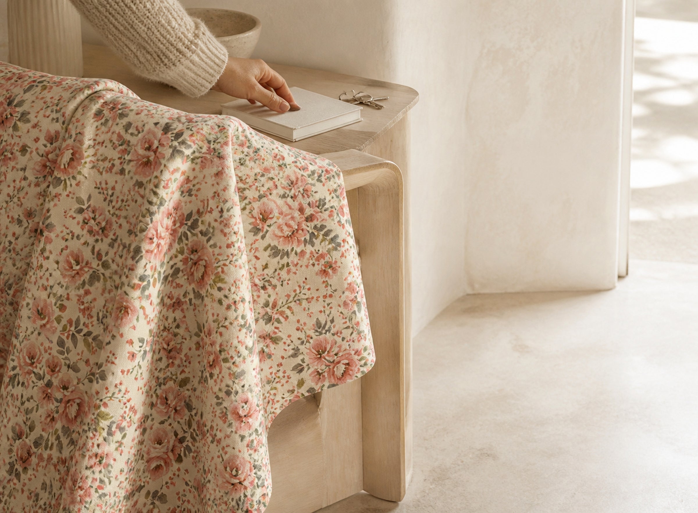 Chintz floral pattern with a hand, book and keys in a quiet entryway scene